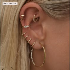 a woman's ear with three different types of piercings