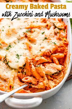 creamy baked pasta with zucchini and mushrooms in a white casserole dish