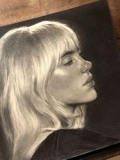 a pencil drawing of a woman's face with long blonde hair and eyes closed