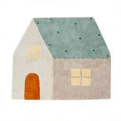 a small rug with a house on it