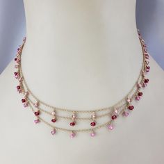 14 Karat Yellow Gold Triple Strand Gemstone Necklace-  This lovely piece features natural pink sapphires (medium pink), pink tourmaline stones (light pink) and synthetic spinel stones(dark pink) set on a 14K triple chain cable necklace.   Beads measure 6mm each.  Stamped: 14K  Size: 15 inches  Weight:  6.2 dwt. / 9.7 gr.  Very good condition, professionally polished.  Will come packaged in a gift box or pouch (when possible) and will be shipped U.S. Priority Mail Insured.  JAGI ID 1/31/24 Flat Gold Necklace, Light Weight Necklace, Chanel Pendant, Peridot Necklace, Necklace Beads, Pink Set, Medallion Necklace, Tourmaline Stone, Sapphire Necklace