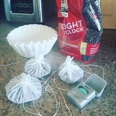 three bags of food sitting on top of a kitchen counter next to an electric blender