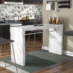 a kitchen with marble counter tops and bar stools