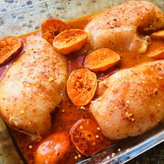 the chicken is covered with tomatoes and spices