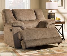 a living room with a brown recliner