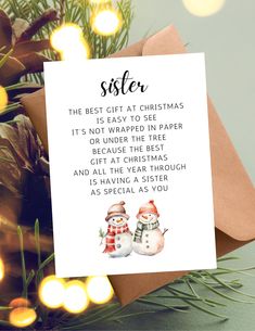 a christmas card with two snowmen on it and the words sister written in black