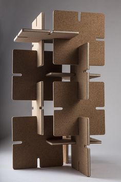 a book shelf made out of cardboard with multiple compartments