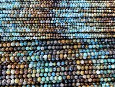 many different colored beads are stacked on top of each other