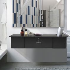 a bathroom with a sink, mirror and bathtub in it's center area