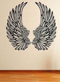 an artistic wall decal with two large wings on it's side, in black