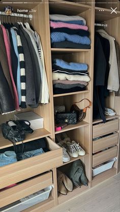 an organized closet with clothes and shoes