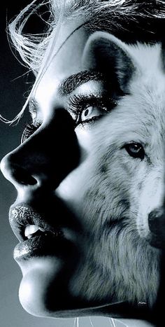 a black and white photo of a woman with wolf makeup