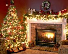 two christmas trees are lit in front of a fireplace and decorated with holiday wreaths