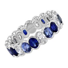 This beautiful and unique eternity band is set with white diamonds and varying shades of deep blue and periwinkle sapphires. Created in 18k white gold. In stock in 2 Sizes: Size 6 - Approx. 1.04 carats of diamonds and 2.54 carats of blue sapphires Size 4 3/4 - Approx. 1.01 carats of diamonds and 2.23 carats of blue sapphires Fine Jewelry Sapphire Eternity Band For Anniversary, Fine Jewelry Sapphire Eternity Band, Luxury Blue Eternity Band With Round Shape, Luxury Sapphire Half Eternity Jewelry, Luxury Sapphire Eternity Band, Luxury Sapphire Eternity Band Fine Jewelry, Oval Eternity Band, Memory Ring, Diamond Eternity Wedding Band