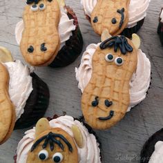 some cupcakes with icing and decorations on them