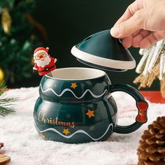 someone is pouring coffee into a christmas mug