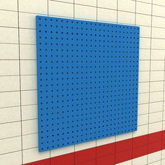 a blue pegboard mounted to the side of a wall next to a red line