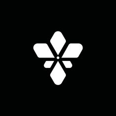 an abstract black and white logo with the shape of a snowflake on it's side