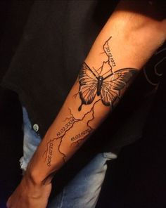 a person with a butterfly tattoo on their arm