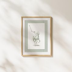 a framed drawing of a man on a horse