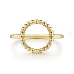 a yellow gold ring with beaded details on the side and a thin band in the middle