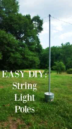 a pole with the words easy diy string light poles on it in front of some trees