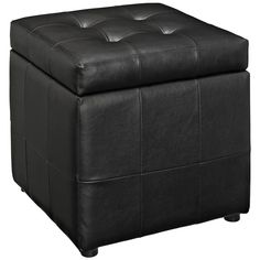 a black leather ottoman sitting on top of a white floor