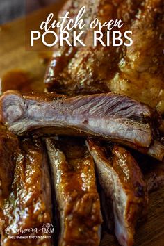 grilled pork ribs on a cutting board with text overlay that reads dutch oven pork ribs