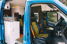 the interior of a blue van with its door open