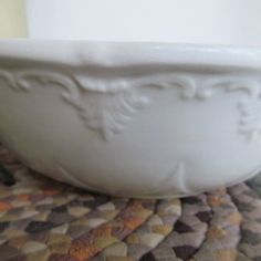 a white bowl sitting on top of a table