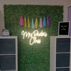 a green wall with clothes hanging on it and the words mr davidson's club