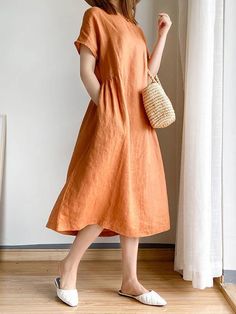 Non-stretch V-neck Dress With Pockets, Non-stretch Beach Dress With Pockets, Plain Non-stretch Knee-length Dresses, Casual A-line Plain Dress, Casual Orange Short Sleeve Maxi Dress, Casual Orange Maxi Dress With Short Sleeves, Plain Short Sleeve Shift Dress, Casual Orange Maxi Dress, Casual Short Sleeve Plain Midi Dress