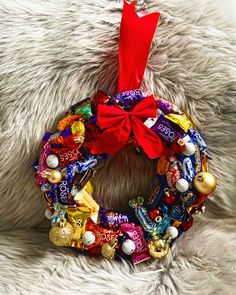 a candy wreath with a red bow on it