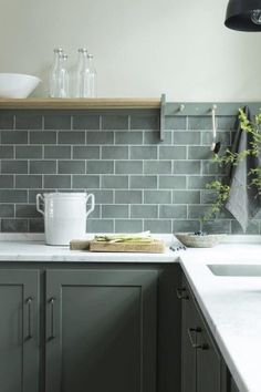 the kitchen counter is clean and ready to be used as a tile backsplash