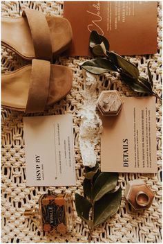 the contents of a wedding suite laid out on a table