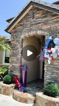 a house decorated with balloons and streamers for a fourth of july celebration in the front yard