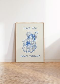 a blue and white poster with the words have you read today? on it sitting in an empty room