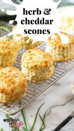 herb and cheddar scones on a cooling rack with herbs in the background