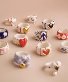 many different rings with hearts and arrows on them