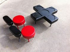 three stools with different colors and shapes on the ground next to eachother