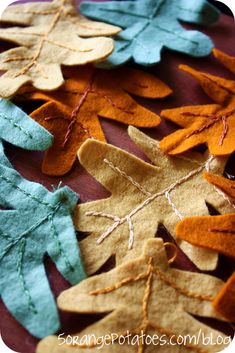 felt leaves are laid out on a table