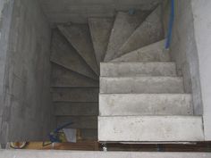 the stairs are made of concrete and have blue tape on them