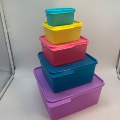 four plastic containers stacked on top of each other