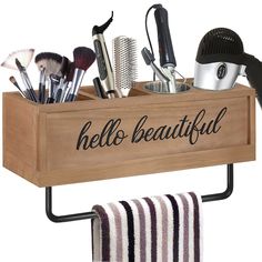 a wooden box with hair brushes and combs in it that says hello beautiful on the side