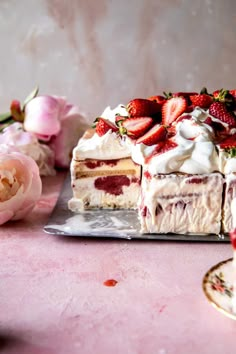 a piece of cake with strawberries on top