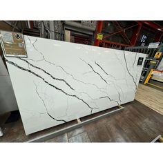 a large white marble slab in a warehouse