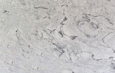 a white marble counter top that looks like it could be used as a wallpaper