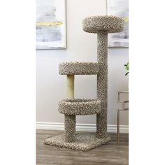 a cat tree in the middle of a living room with flowers on the side table