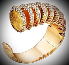 CARTIER. ‘POLYMORPH’ Bracelet - 18K rose gold (750/1000), chalcedonies, moonstones, citrines, opals, rutile quartz, spessartite garnets, pink and yellow sapphires and 76 brilliant-cut diamonds totaling 3.87 carats (~ USD 200,000) #CARTIER #CARTIER2024 #CARTIERLibre2024 #CARTIERPolymorph #HighJewelry #CARTIERLibrePolymorph #Diamond Diamond Bangles, Spessartite Garnet, Rutile Quartz, Diamond Bangle, Pink And Yellow, Diamond Jewellery, Yellow Sapphire, Moon Stone