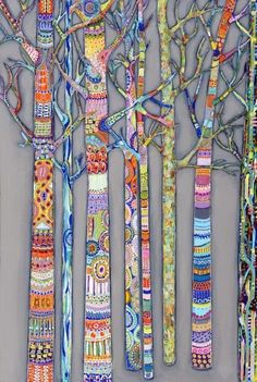 a group of trees that are painted with different colors